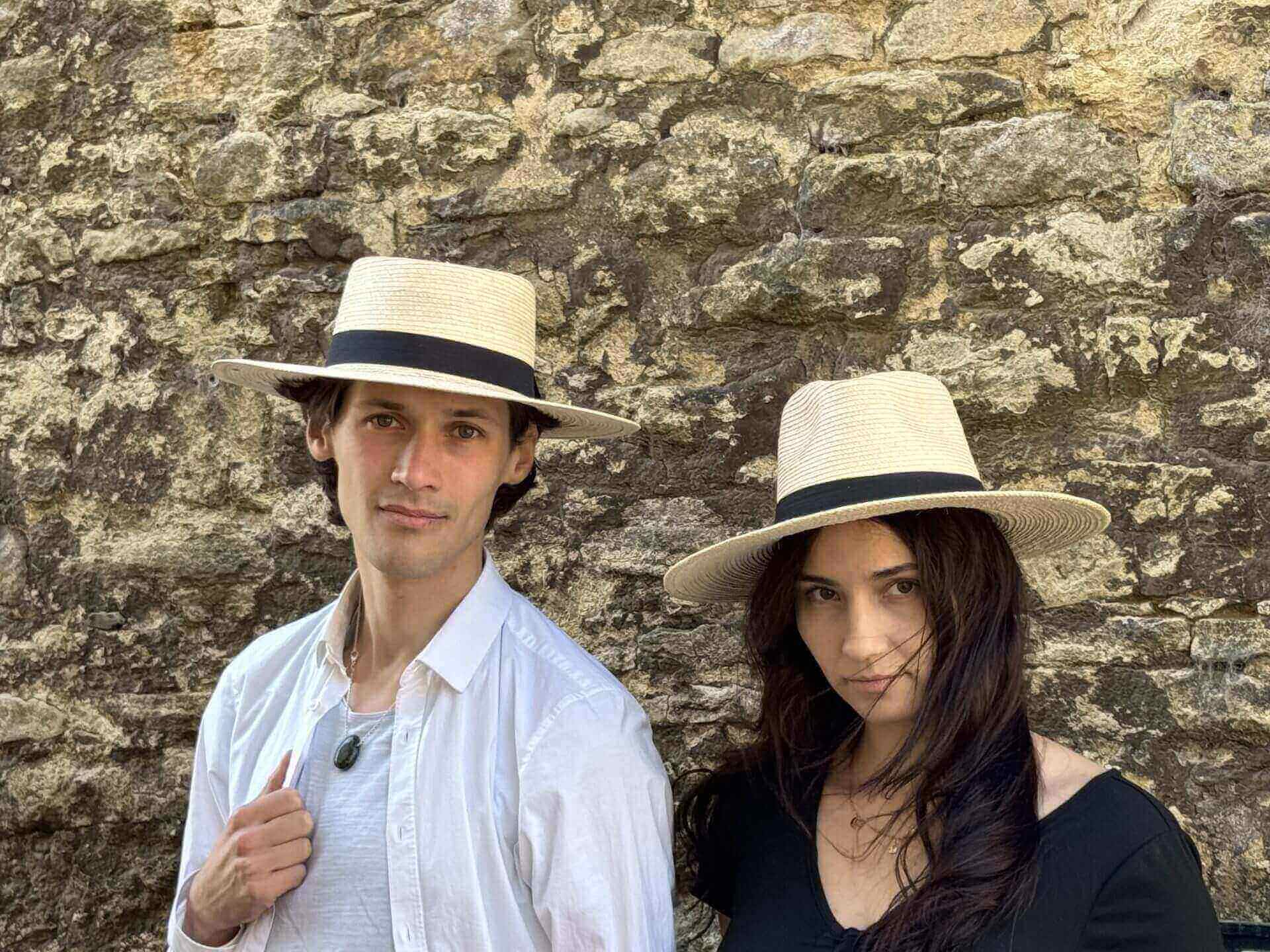 Couple wearing straw hats